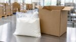 Bag-in-box liquid packaging with a cardboard box in a warehouse